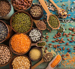 Raw legume on old rustic wooden table, close-up.